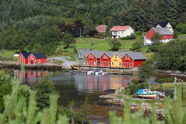 Fishing harbor in Leinoya island in municipality of Heroy, Norway. Norwegian village architecture.