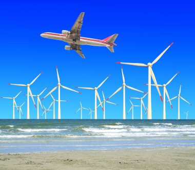 eco güç Rüzgar türbinleri içinde uçan bir uçak