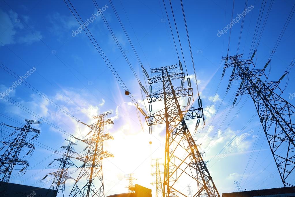 The power transmission towers of sunset sky background