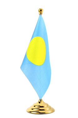 palau Cumhuriyeti bayrağı üzerinde altın bayrak direğine asılı