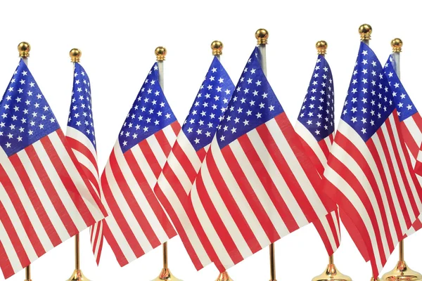 United States of America flags hanging on the gold flagpole — Stock Photo, Image