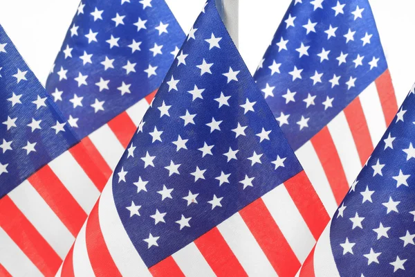 United States flags hanging in the queue on flagpole — Stock Photo, Image