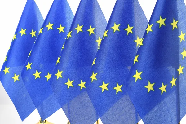 EU flags hanging in the queue of flagpole — Stock Photo, Image