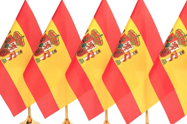 Bandeiras da Espanha penduradas na bandeira dourada — Fotografia de Stock