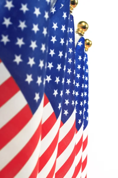 United States of America flags hanging on the gold flagpole — Stock Photo, Image