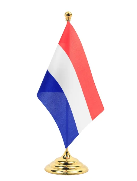 Netherlands National flag hanging on the gold flagstaff — Stock Photo, Image