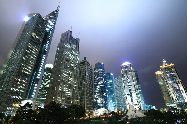 Looking up to Shanghai urban landmark buildings background night — Stock Photo, Image