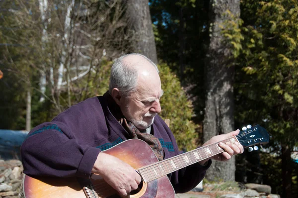 Senior Man Playing Acoustic Guitar Garden —  Fotos de Stock
