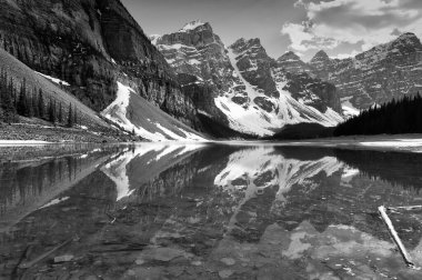 Valley of Ten Peaks glaciers scenic view with reflections in Moraine Lake in Banff National Park, Alberta, Canada -black and white