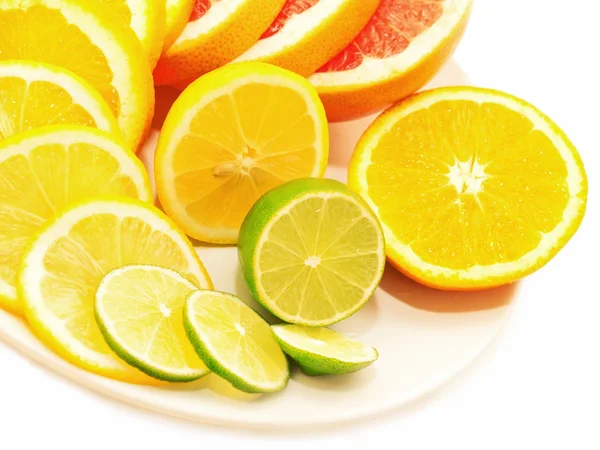 Ripe citrus slices on plate isolated on white — Stock Photo, Image