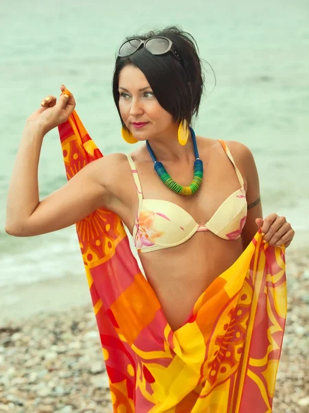 Woman in bikini and pareo at sea background — Stock Photo, Image