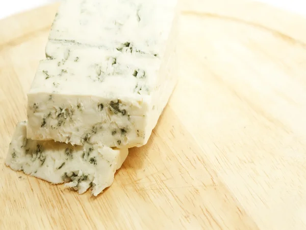 Slices dor blue cheese on wooden desk — Stock Photo, Image