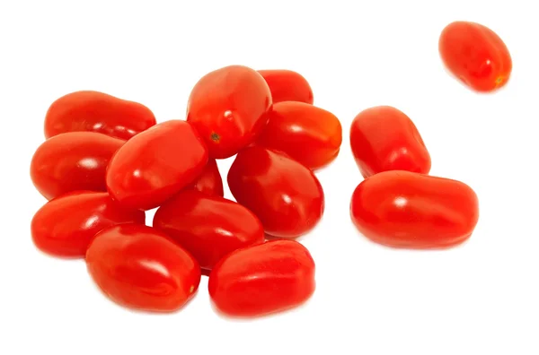 Tomates rojos cereza aislados en blanco Fotos de stock