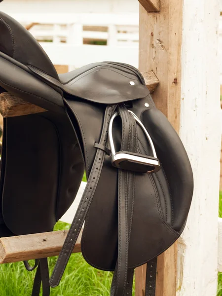 Dressage saddle at the bracket. outdoor — Stock Photo, Image