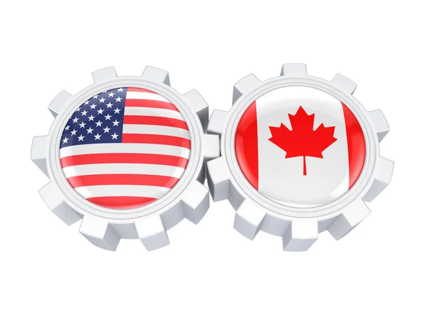 Banderas americanas y canadienses en un engranaje . — Foto de Stock