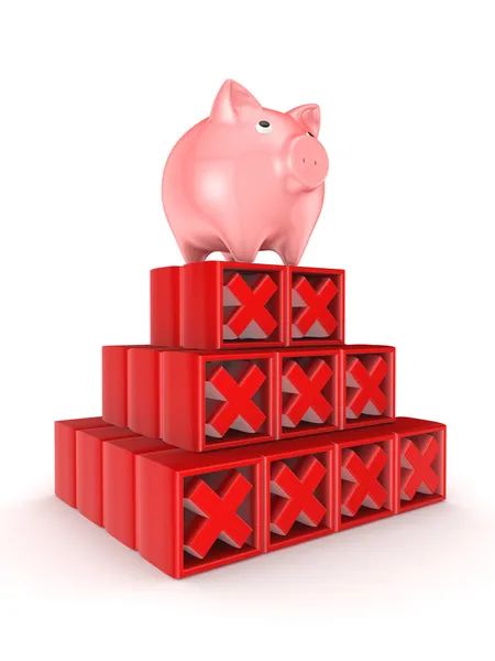 Roze piggy bank op een top van Rode Kruis merken. — Stockfoto