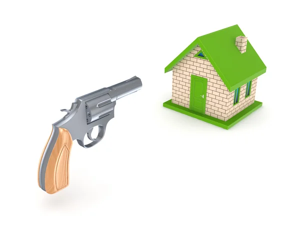 Revolver and small house. — Stock Photo, Image