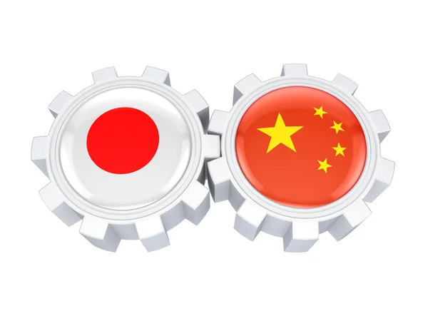 Japońskie i chińskie flagi na koła zębate. — Zdjęcie stockowe