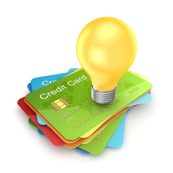 Yellow lamp on a colorful credit cards. — Stock Photo, Image