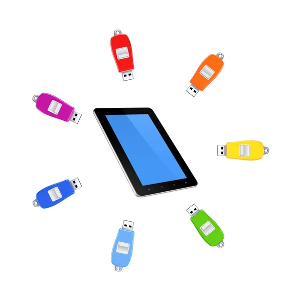 Kleurrijke flashdrives rond tablet-pc. — Stockfoto