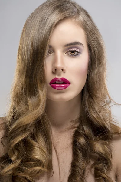 Girl with flowing hair portrait in front of the camera — Stok fotoğraf