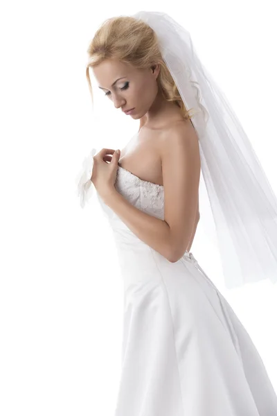 Pretty blonde bride with hand on the breast — Stock Photo, Image