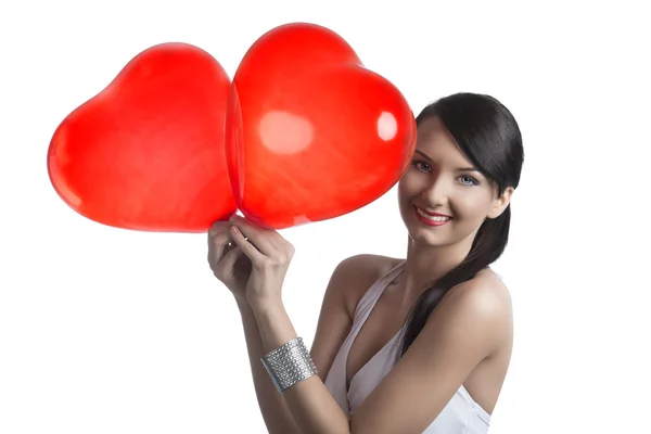 Sexig brunett med Hjärtformade ballonger leenden — Stockfoto