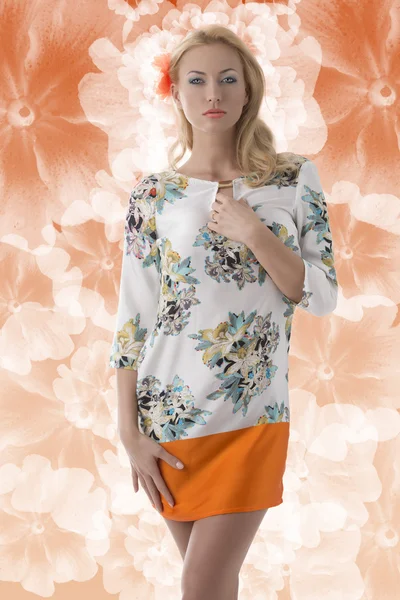 Blonde clothing dress with floral pattern in front of the camera — Stock Photo, Image