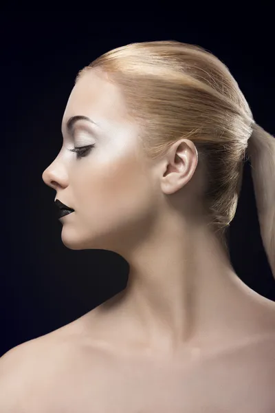 Blonde girl in profile with dark lipstick Royalty Free Stock Photos