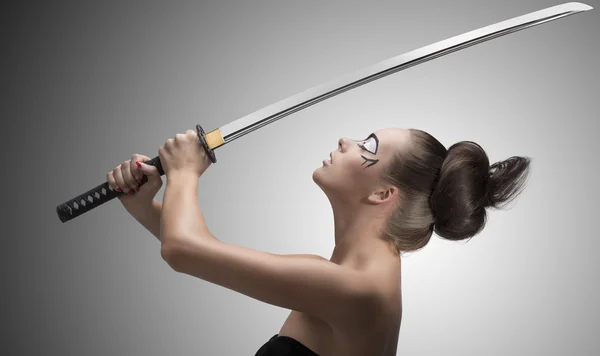 Brunette in japan style with katana taked with both hands — Stock Photo, Image