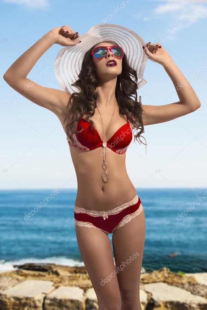 fashion girl in swimsuit with summer hat