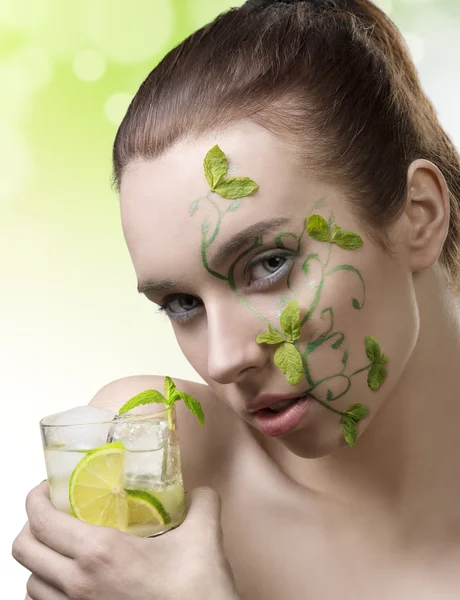 Cute girl with fresh make-up drinking cocktail — Stock Photo, Image