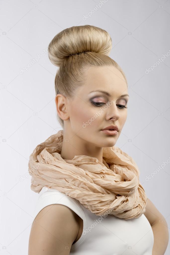 sweet girl with nice hairstyle looking down