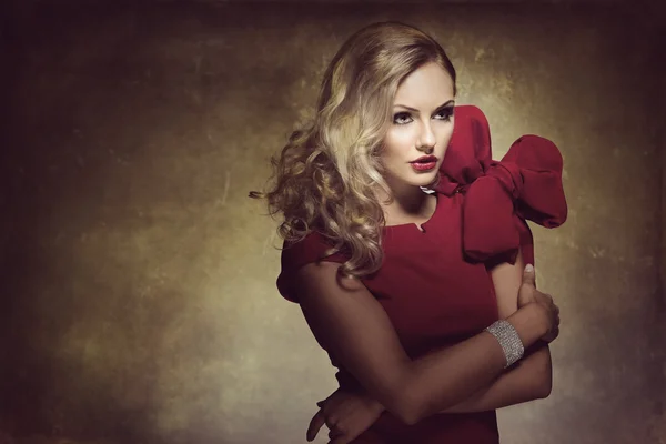 Woman in red with big bow — Stock Photo, Image