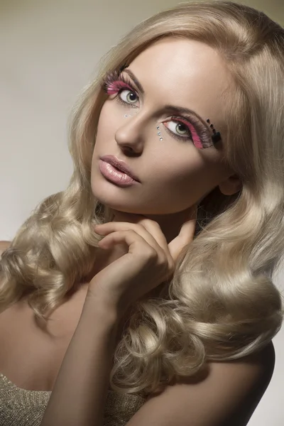 Woman with creative feathered make-up — Stock Photo, Image