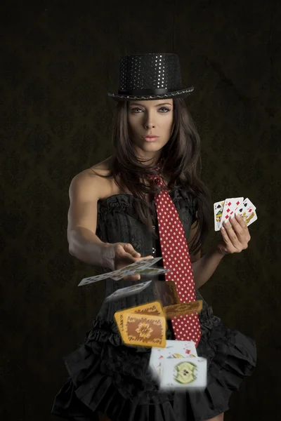 Cute girl throwing poker cards — Stock Photo, Image