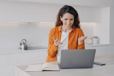 Teacher has lesson online on laptop. Female european tutor is teaching her students language online. Remote class and distance education at home on quarantine. E-learning via zoom.