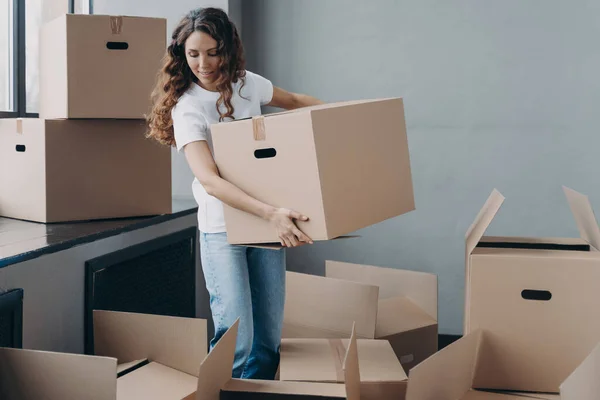 Happy Curly Girl Carrying Box Relocating Hispanic Woman Unpacking Boxes — Foto de Stock