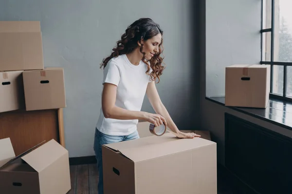 Curly Spanish Girl Ready Relocation Lady Wrapping Cardboard Boxes Packing — Foto de Stock