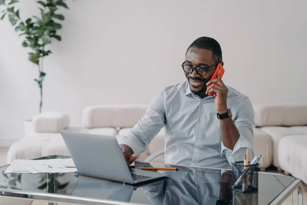 Freelancer Working Online Having Conversation Client Phone Happy Afro Businessman — Zdjęcie stockowe