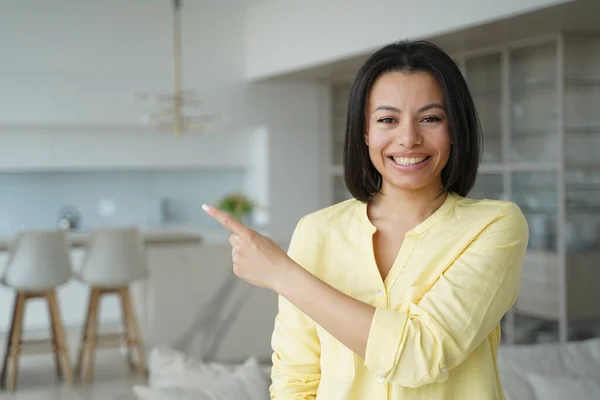 Smiling Female Realtor Homeowner Tenant Pointing Finger Copy Space Aside —  Fotos de Stock