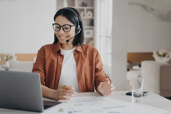 Friendly Female Coach Wearing Glasses Headset Conducts Webinar Laptop Smiling —  Fotos de Stock