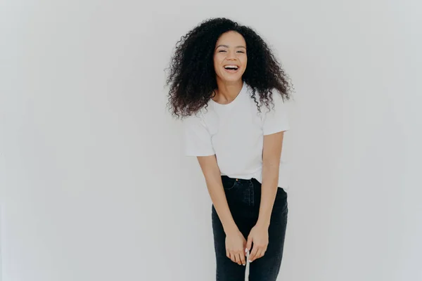 Studio Shot Joyful African American Woman Laughs Happily Dressed Casual — стокове фото