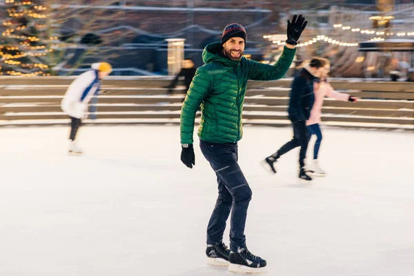 Happy Male Waves Hand Notices His Friend Skating Ring Have — Stock Photo, Image