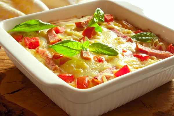 Casserole with cheese, bacon and tomatoes — Stock Photo, Image