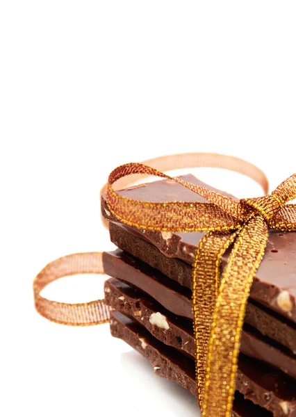 Pilha de chocolate liso no fundo branco — Fotografia de Stock