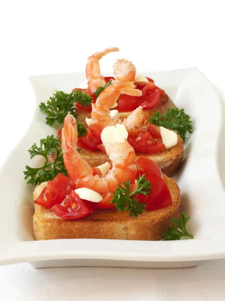 Toasts with tomatoes and shrimp — Stock Photo, Image