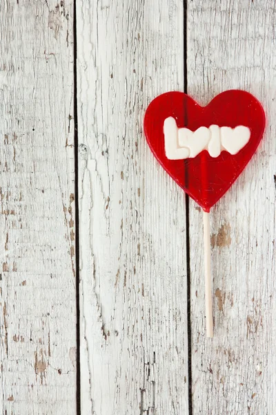 De dag van Valentijnskaarten achtergrond met lolly hart — Stockfoto