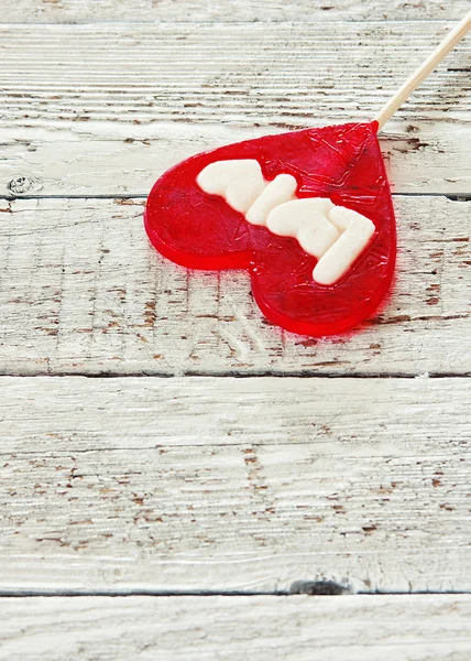 De dag van Valentijnskaarten achtergrond met lolly hart — Stockfoto