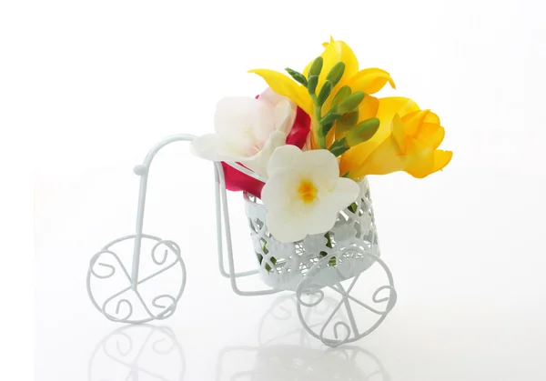 Beautiful freesia flowers in cute vintage bike — Stock Photo, Image